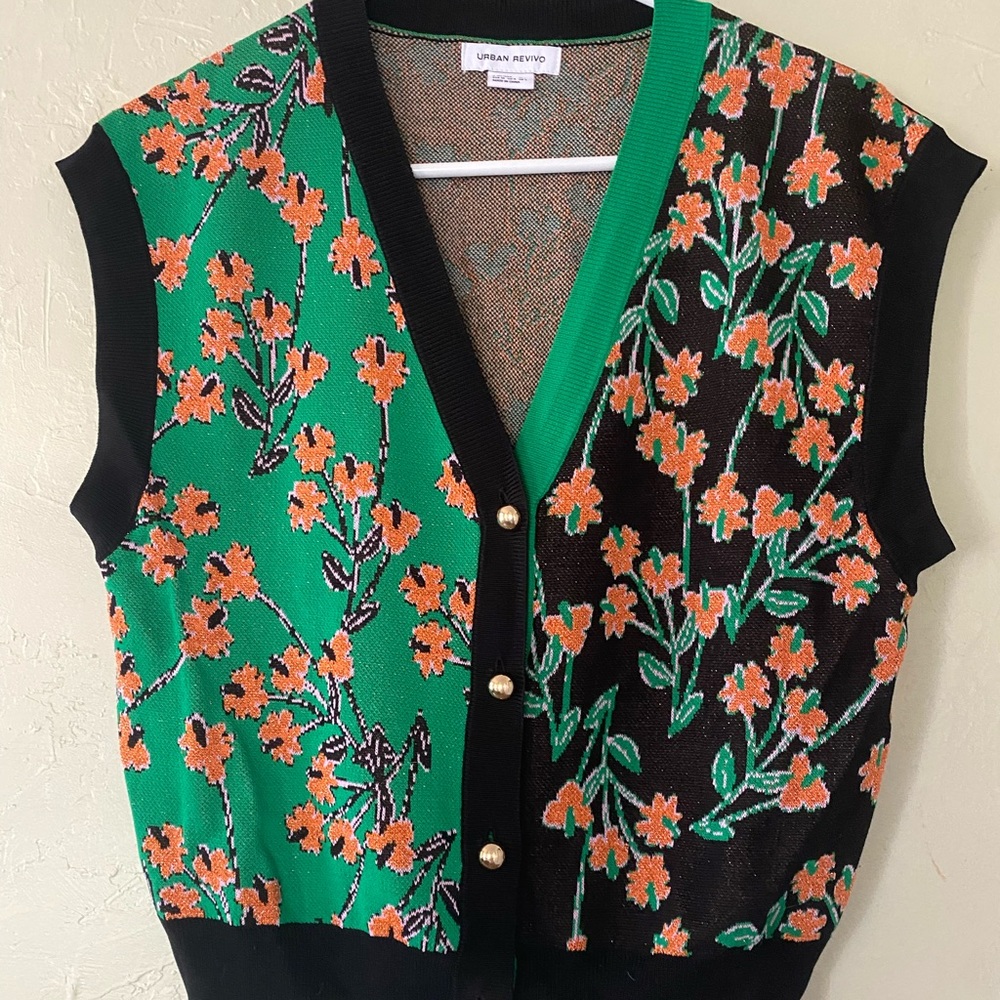 Brand new sweater vest. Black, orange & green. Never worn.